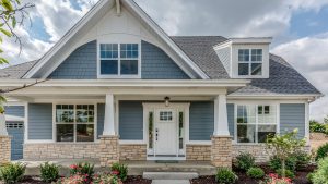 2-story home in the suburbs of Atlanta, Georgia. Behind the home are blue skies.